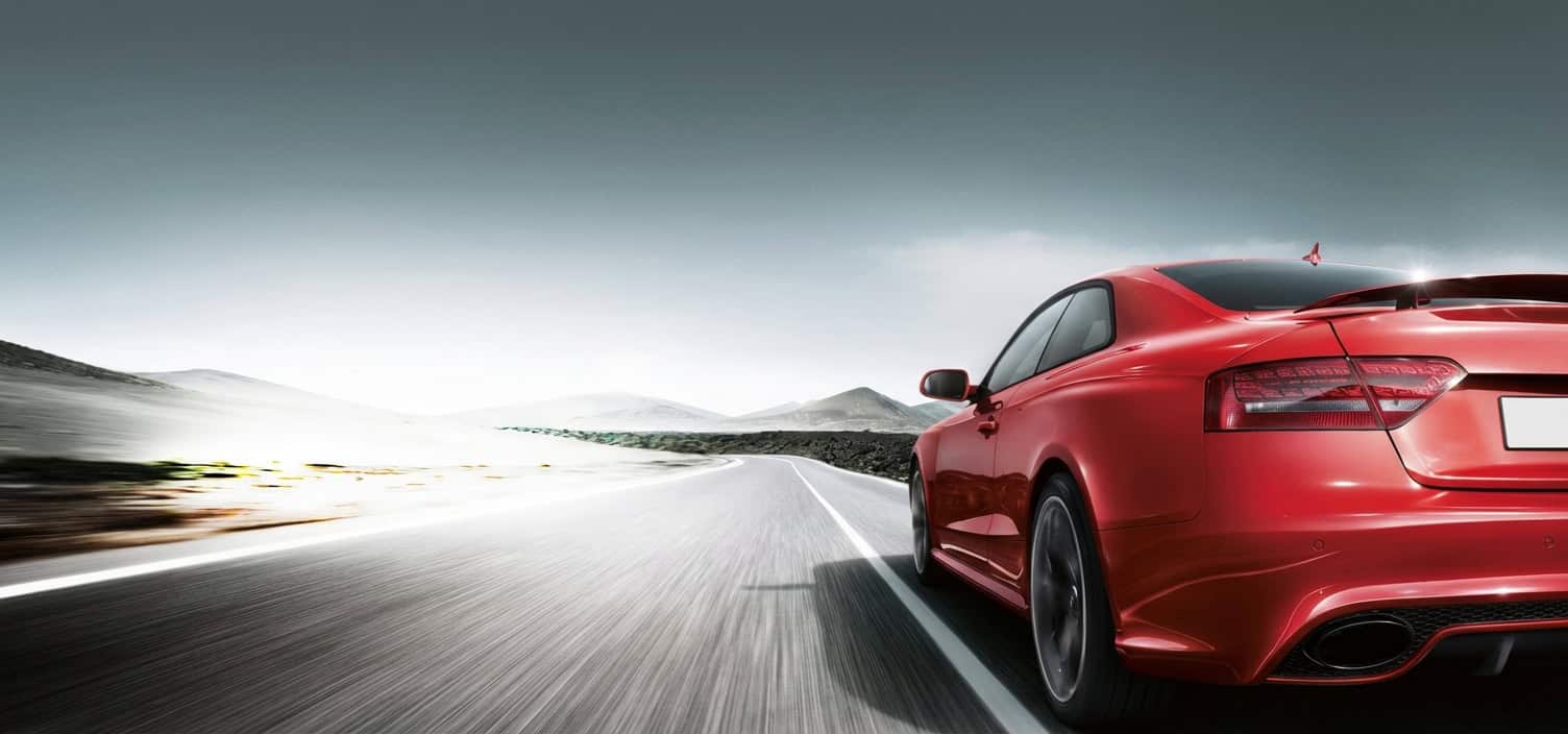Red car undergoing smog check at Vu & Vu Smog Check Test Only Center.